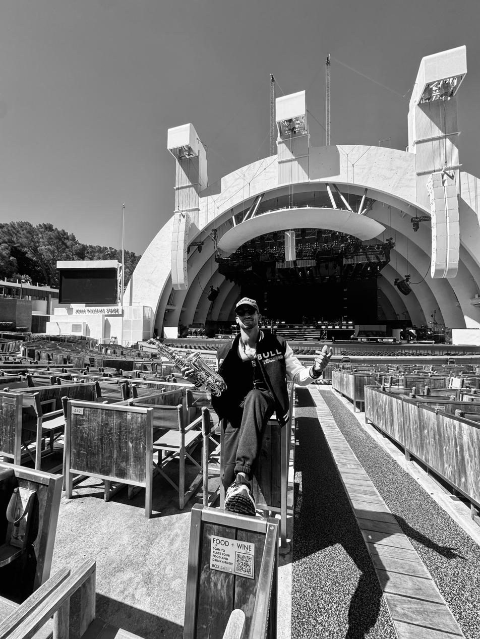 Luiso among the empty seats of the Hollywood Bowl, in black and white.